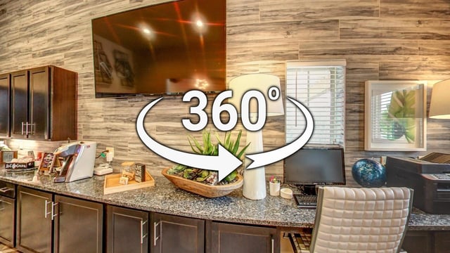 360 virtual tour of a common area with a coffee station and workspace.
