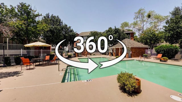 360 virtual tour of the community swimming pool with lounge chairs and a shaded seating area.