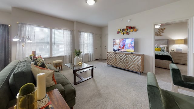 Living room and bedroom of an apartment.