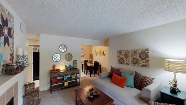 Living room and dining area with sofa, coffee table, and dining table.