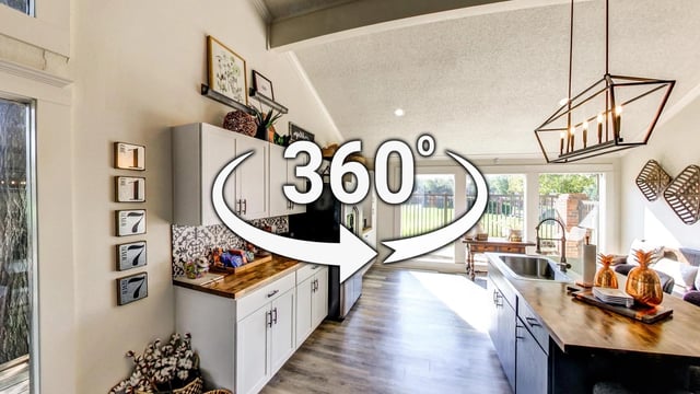 360-degree view of an apartment kitchen and living area.