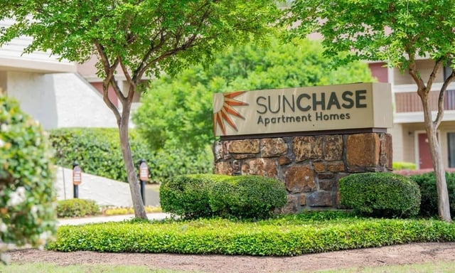 SunChase Apartment Homes monument sign with landscaping.