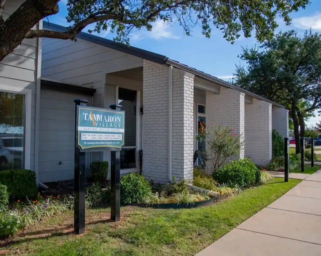 Exterior view of the leasing office at Tammaron Village with signage and landscaping.