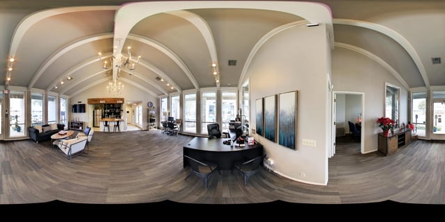 Reception area with seating, desk, and coffee bar.