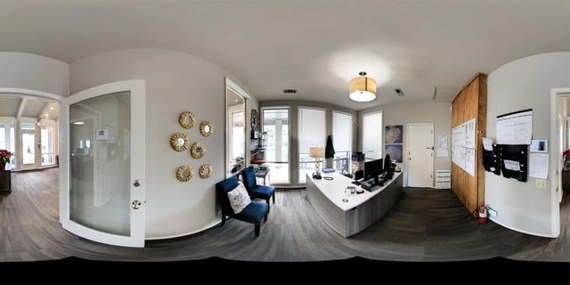 Reception desk and waiting area in a modern apartment building.