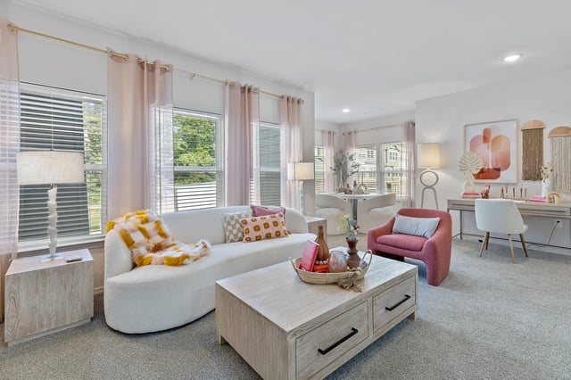 Stylish living room with light decor and modern furnishings.