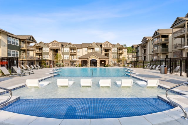 Swimming pool and lounge area at an apartment complex.