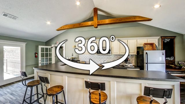 Kitchen area with a breakfast bar and stools