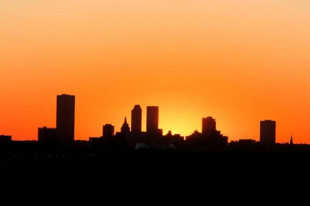 The silhouette of the Tulsa, OK, skyline at sunset.