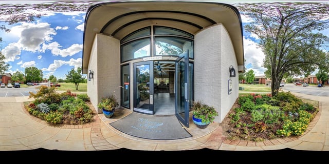 Entrance to Waters Edge Apartments with landscaping.