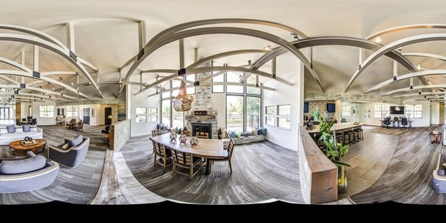 Modern lounge area with fireplace and large windows