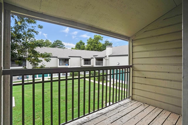 View from balcony of apartment building exterior and courtyard
