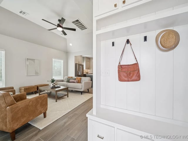 Spacious living area with modern furniture and decorative items