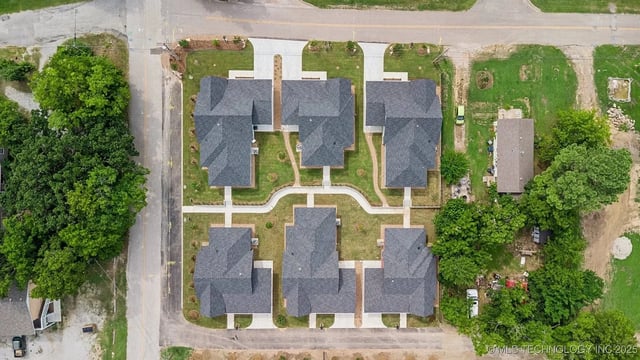 Aerial view of housing development layout with multiple units arranged in a pattern.