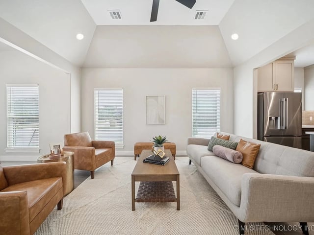 Modern living room with a couch and armchairs