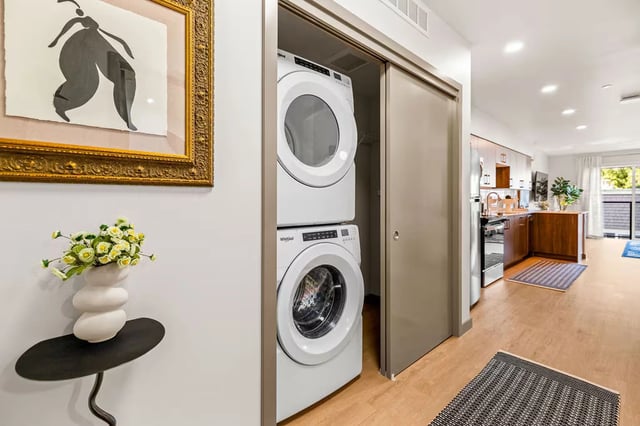 In-unit washer and dryer stacked in a closet.