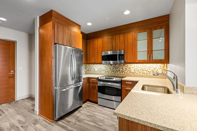 Kitchen with stainless steel appliances and wood cabinetry.