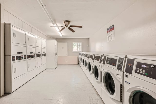 Laundry room with multiple washers and dryers.