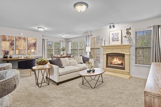 Living room with fireplace and dining area.