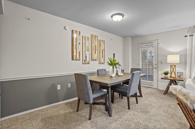 Dining room with a table and four chairs.