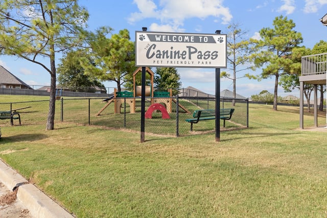 Welcome to Canine Pass, a pet-friendly park with agility equipment and seating.