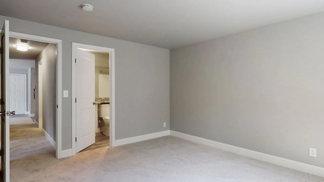 Bedroom with an adjoining bathroom and hallway