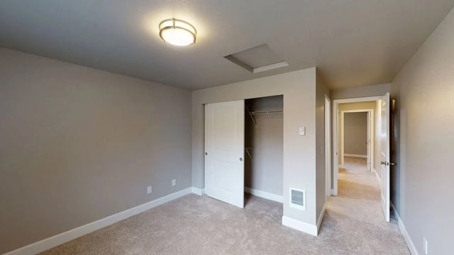 Bedroom with closet and hallway access