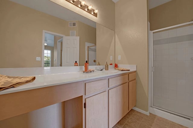 Bathroom vanity with double sinks and a walk-in shower.