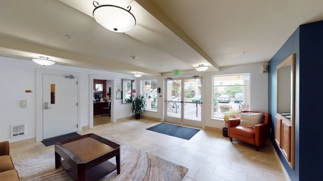 Lobby entrance with seating area and reception desk visible.