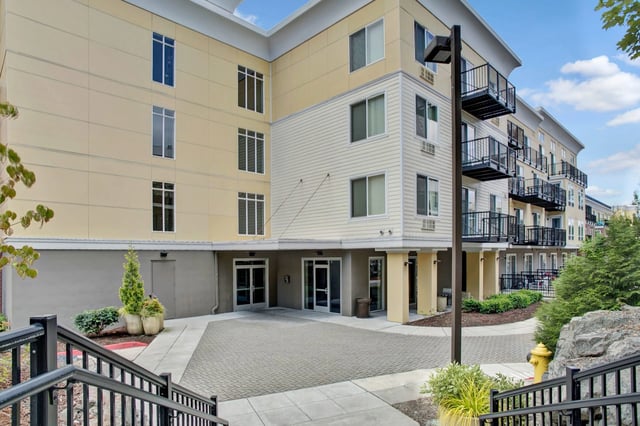 Building exterior with balconies and entrances.