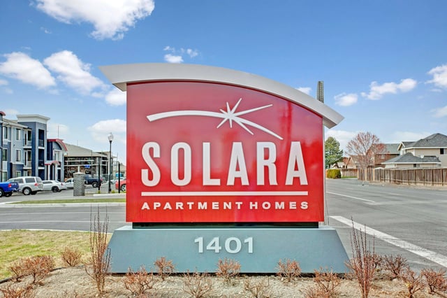 Solara Apartment Homes monument sign with address 1401.