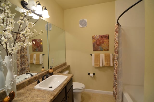 Bathroom with vanity, toilet, and bathtub.