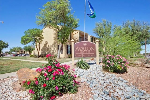 Avalon Springs Apartment Homes signage with landscaping.