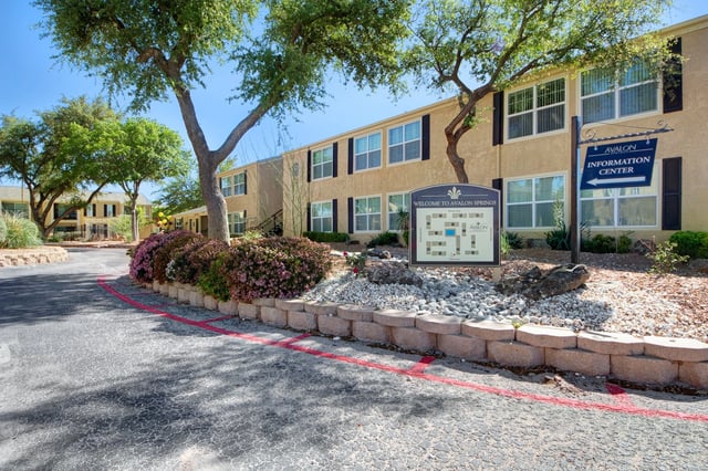 Welcome sign and information center at Avalon Springs apartments.