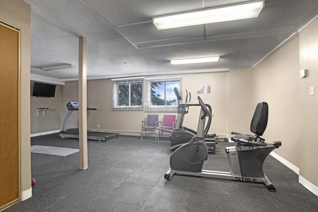 Fitness center with treadmills, elliptical, and recumbent bikes.