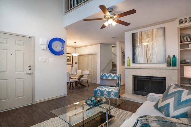 Living room with fireplace and dining area