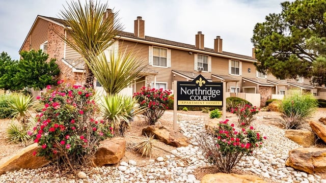 Northridge Court apartment building exterior with landscaping and signage
