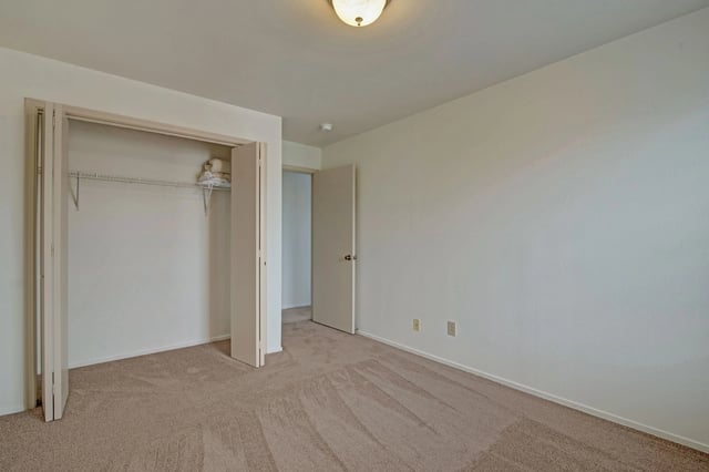 Bedroom with closet and door