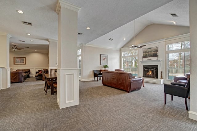 Clubhouse lounge area with fireplace and seating