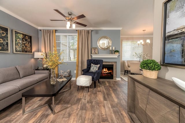 Living room with a fireplace, couch, and coffee table.