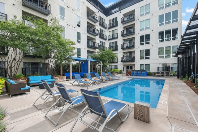 Courtyard with a pool and lounge chairs