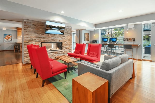 Comfortable seating area with a fireplace and a business center