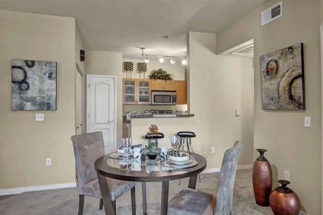 Dining area and kitchen in apartment.