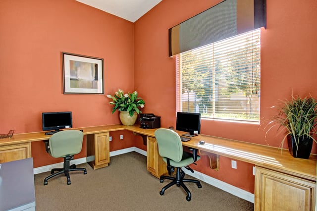 Community business center with computers and printer.