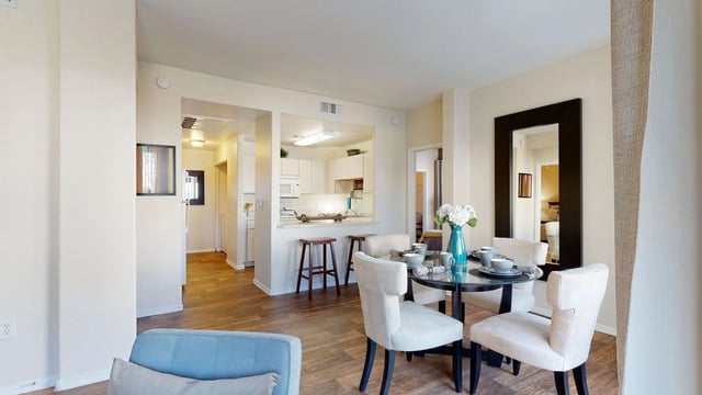 Dining area and kitchen view of a multifamily property.