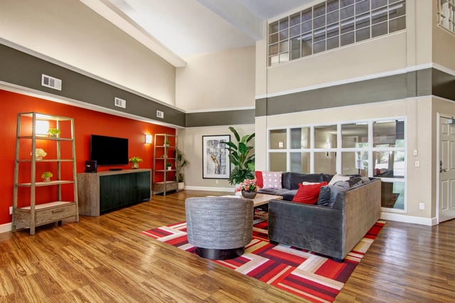 Lobby seating area with couches, accent chairs, and a coffee table.