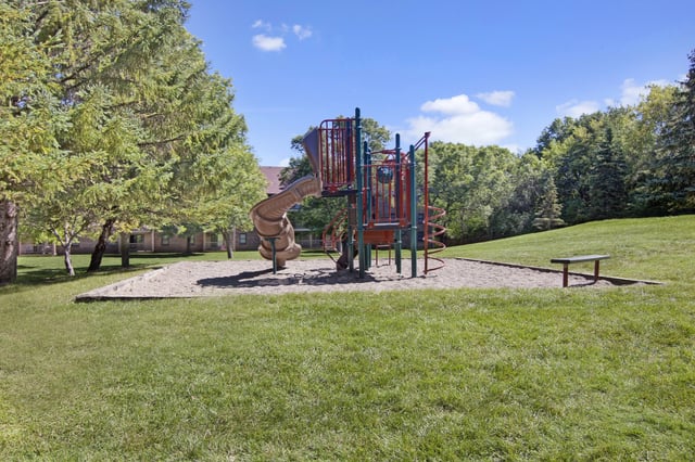 Playground with slide and bench.