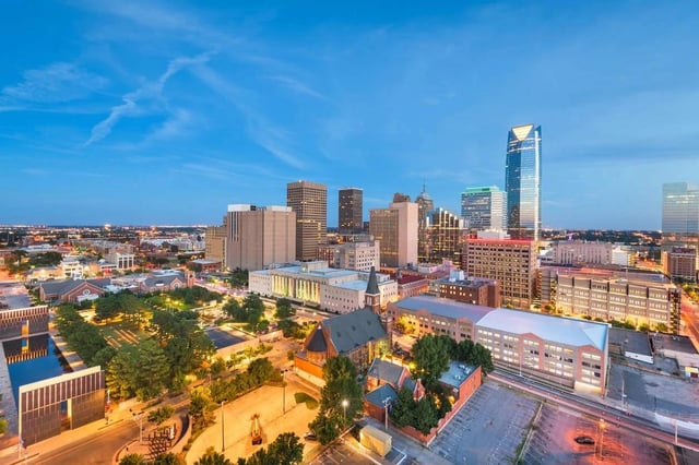 Aerial view of the downtown skyline with tall buildings and streets below.