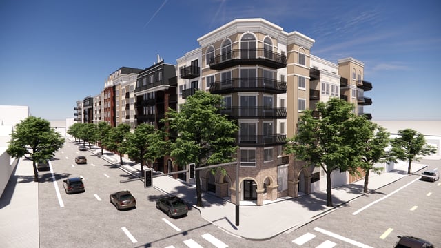 Exterior view of a modern apartment building with balconies and trees.