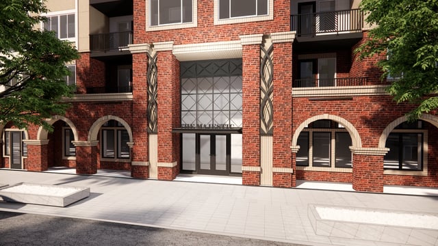 The Majestic apartment building entrance with brick facade and arched windows.